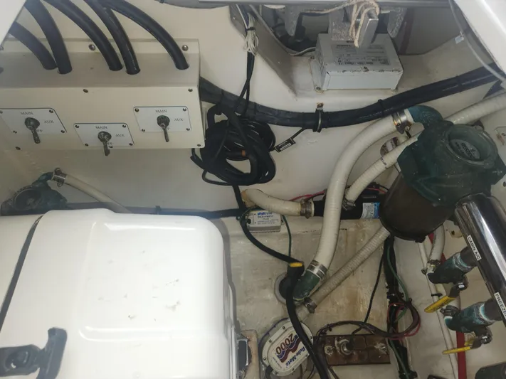  Yacht Photos Pics Engine compartment of a 2015 Jupiter 41 SB boat, showing wiring and mechanical components.