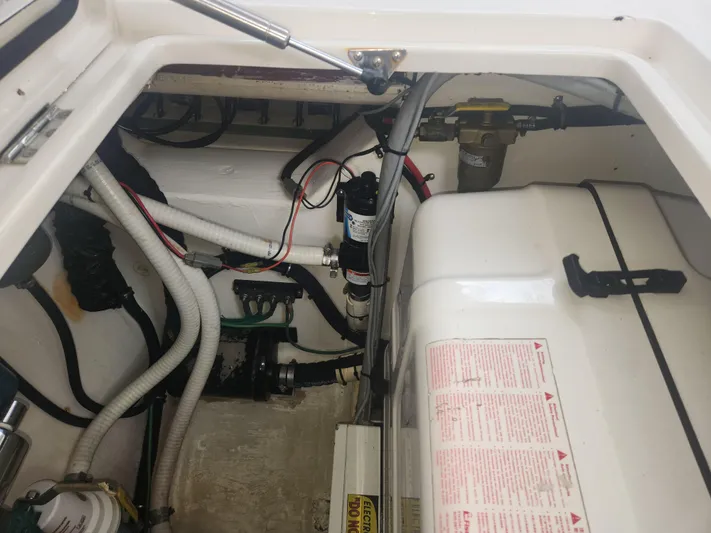 Yacht Photos Pics Engine compartment of a 2015 Jupiter 41 SB boat, showing various mechanical components.