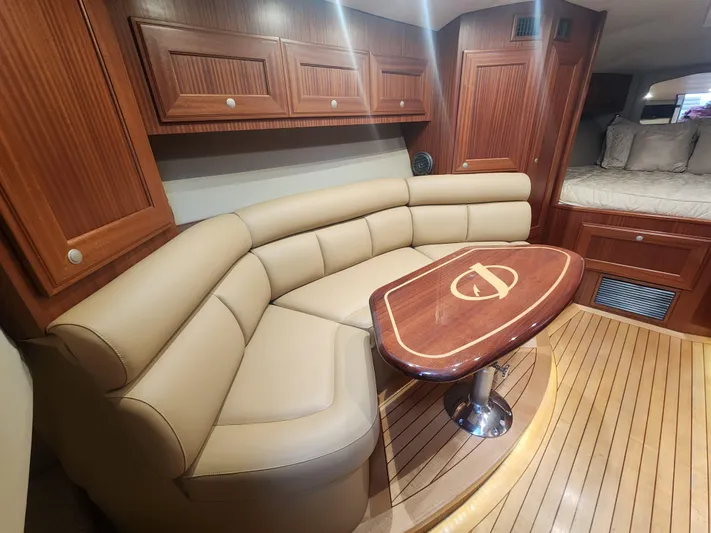  Yacht Photos Pics Luxurious interior of 2015 Jupiter 41 SB yacht with leather seating and wooden accents.