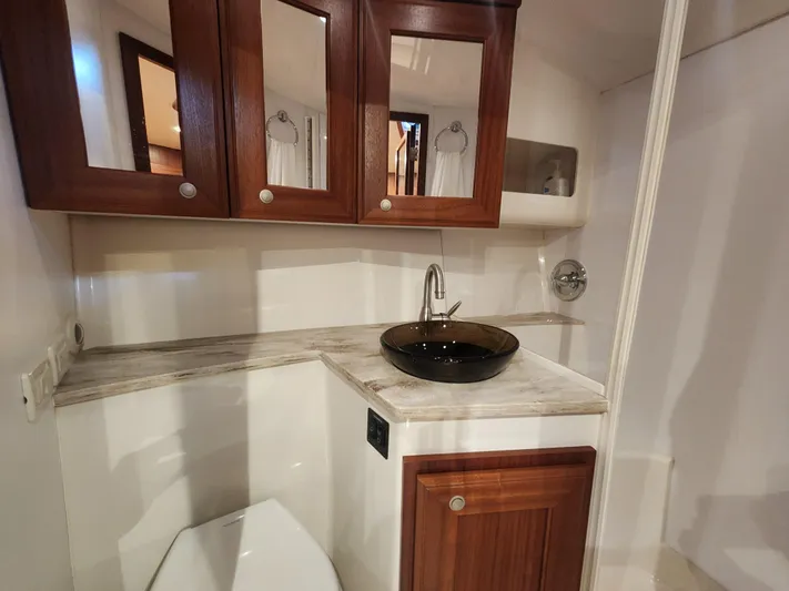  Yacht Photos Pics Luxurious bathroom in 2015 Jupiter 41 SB yacht with elegant wood cabinetry.