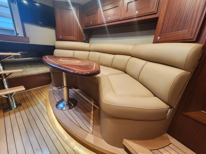  Yacht Photos Pics Luxurious interior of 2015 Jupiter 41 SB yacht with leather seating and wooden accents.