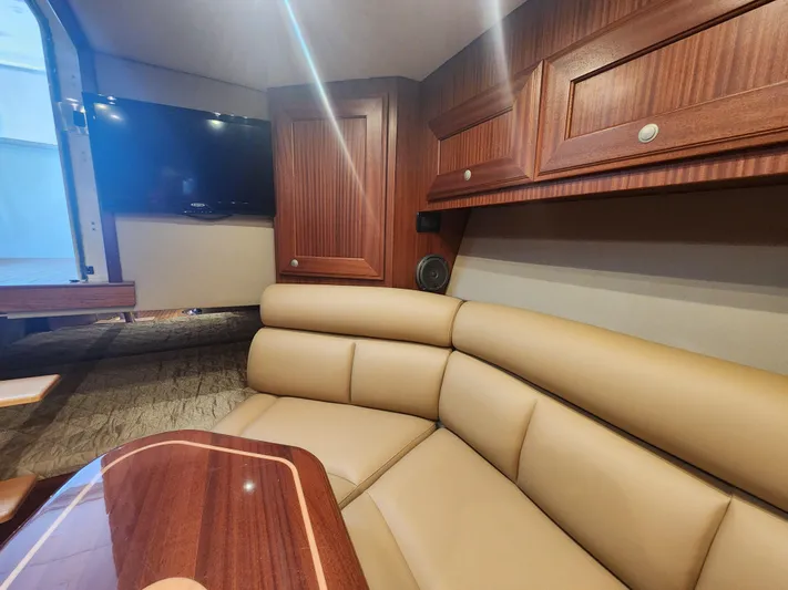  Yacht Photos Pics Luxurious interior of 2015 Jupiter 41 SB yacht with leather seating and wood finishes.