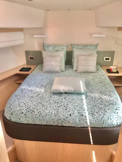  Yacht Photos Pics Luxurious bedroom interior of 2018 Guy Couach 1900 yacht with modern bedding.