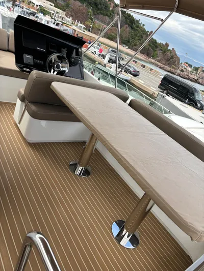 Yacht Photos Pics Luxurious 2018 Guy Couach 1900 yacht interior with elegant seating and table.