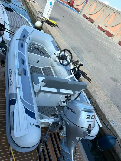 Yacht Photos Pics Inflatable boat with Honda 20 outboard motor, docked beside a Guy Couach 1900, 2018 model.
