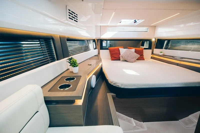  Yacht Photos Pics Luxurious interior of 2023 Wellcraft 355 yacht with modern design and cozy bedding.