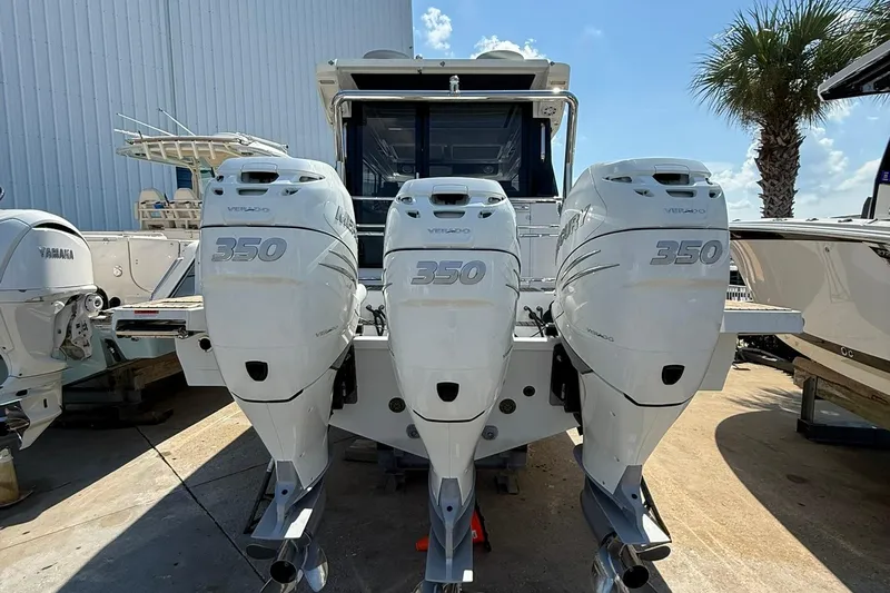  Yacht Photos Pics 2023 Wellcraft 355 boat with triple Mercury 350 outboard engines, docked outdoors.