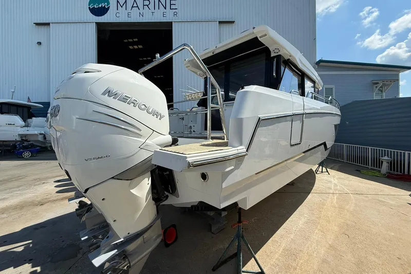  Yacht Photos Pics 2023 Wellcraft 355 boat with Mercury engine at marine center.