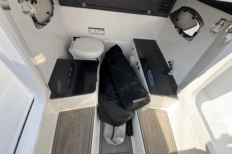  Yacht Photos Pics Interior of 2026 Monterey Elite 25 OB boat with toilet and sink.