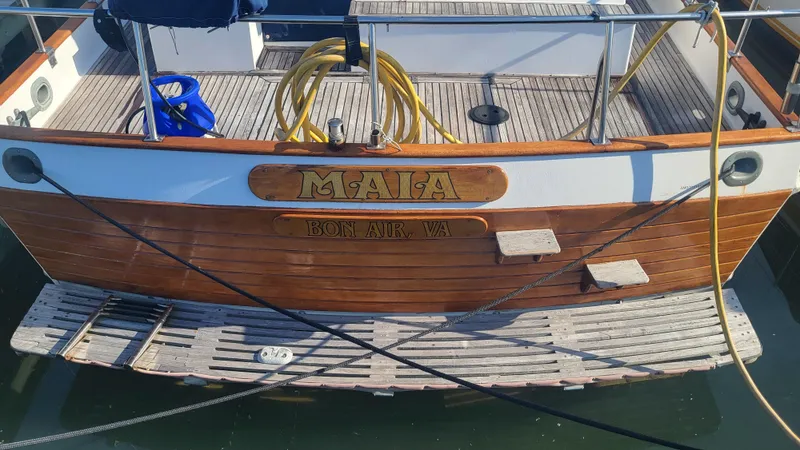 Maia Yacht Photos Pics 1989 Grand Banks 42 Classic boat stern with wooden deck and name "MAIA".