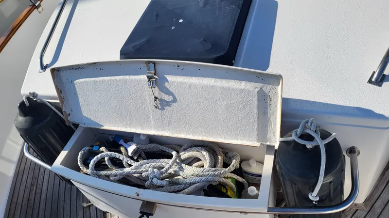Maia Yacht Photos Pics Open storage compartment on 1989 Grand Banks 42 Classic boat with ropes and equipment.