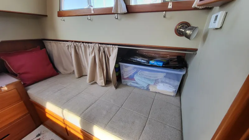 Maia Yacht Photos Pics Cozy cabin interior of 1989 Grand Banks 42 Classic with storage and seating.