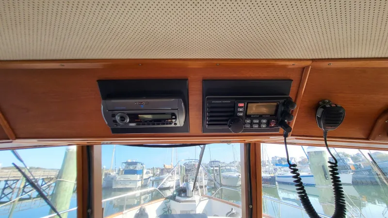 Maia Yacht Photos Pics Interior view of 1989 Grand Banks 42 Classic boat dashboard with radio equipment.