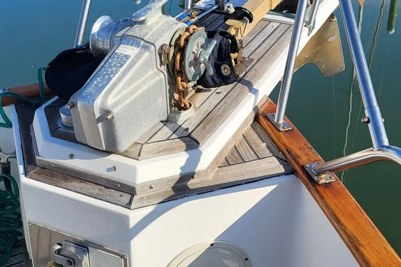 Maia Yacht Photos Pics 1989 Grand Banks 42 Classic yacht deck with anchor winch and wooden trim.