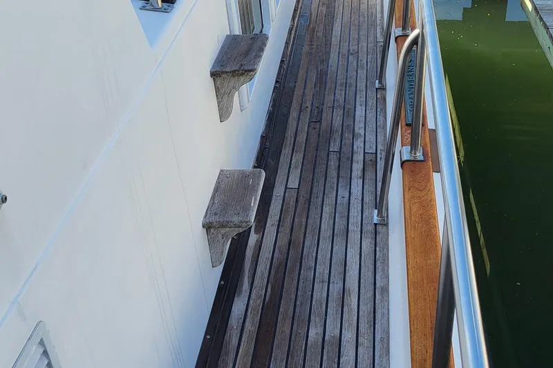 Maia Yacht Photos Pics Wooden deck of 1989 Grand Banks 42 Classic yacht by the water.