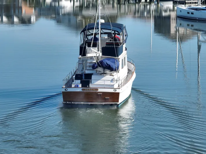 Maia Yacht Photos Pics 1989 Grand Banks 42 Classic yacht cruising on calm waters.