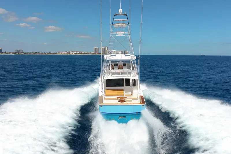 Defiance Yacht Photos Pics 2007 Viking 64 Convertible yacht cruising on open blue ocean.