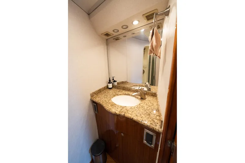 Defiance Yacht Photos Pics Luxurious bathroom in 2007 Viking 64 Convertible yacht with granite countertop and modern fixtures.