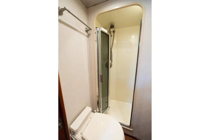 Defiance Yacht Photos Pics Bathroom interior of 2007 Viking 64 Convertible yacht, featuring shower and toilet.
