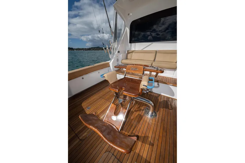 Defiance Yacht Photos Pics 2007 Viking 64 Convertible yacht deck with wooden flooring and fishing chair.