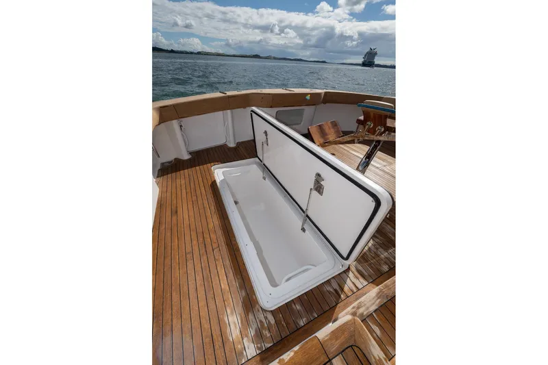 Defiance Yacht Photos Pics Open storage compartment on 2007 Viking 64 Convertible yacht deck, overlooking the ocean.