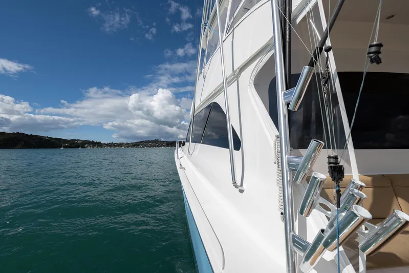 Defiance Yacht Photos Pics 2007 Viking 64 Convertible yacht on calm waters under a partly cloudy sky.