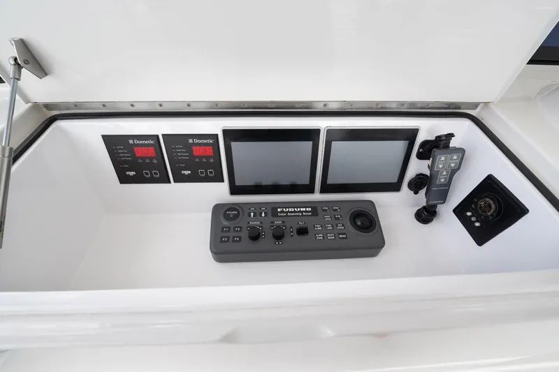 Defiance Yacht Photos Pics Control panel of a 2007 Viking 64 Convertible yacht with navigation and monitoring systems.