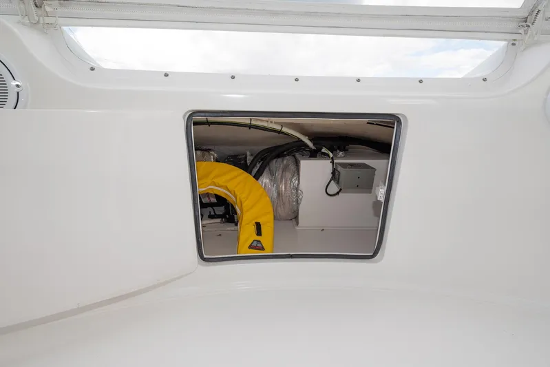 Defiance Yacht Photos Pics Storage compartment on a 2007 Viking 64 Convertible yacht, featuring a yellow life jacket.