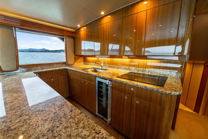 Defiance Yacht Photos Pics Luxurious kitchen interior of 2007 Viking 64 Convertible yacht with granite countertops.