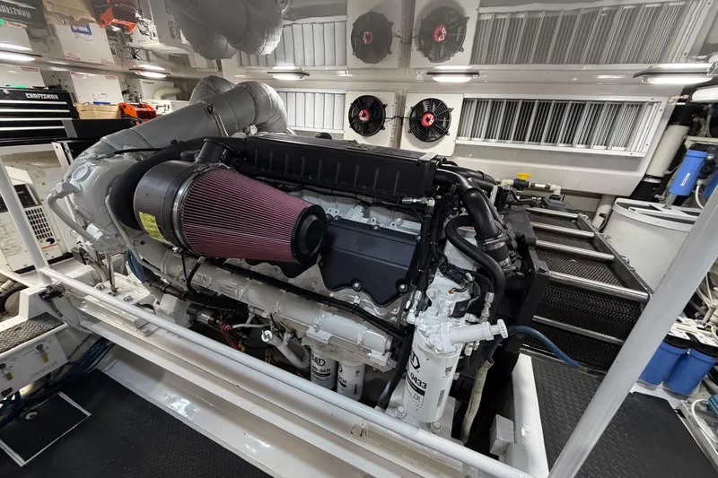 Defiance Yacht Photos Pics Engine room of 2007 Viking 64 Convertible yacht, showcasing a powerful marine engine.