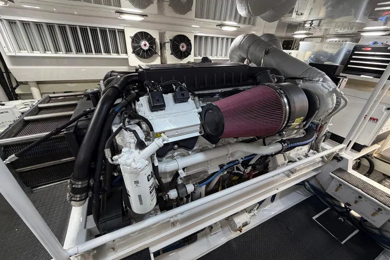 Defiance Yacht Photos Pics Engine room of a 2007 Viking 64 Convertible yacht, showcasing a powerful engine setup.