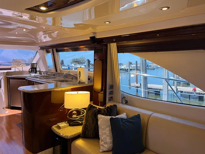  Yacht Photos Pics Luxurious interior of a 2008 Sea Ray 58 Sedan yacht with elegant furnishings and marina view.