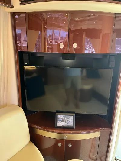  Yacht Photos Pics Interior of 2008 Sea Ray 58 Sedan with TV and wooden cabinetry.