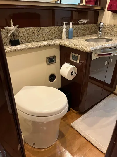  Yacht Photos Pics Luxurious bathroom in 2008 Sea Ray 58 Sedan yacht with granite countertop and modern fixtures.