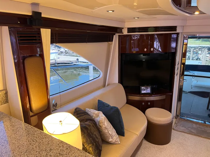  Yacht Photos Pics Luxurious interior of 2008 Sea Ray 58 Sedan yacht with cozy seating and modern decor.