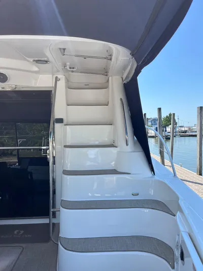  Yacht Photos Pics Staircase on 2008 Sea Ray 58 Sedan yacht, leading to upper deck, dockside view.