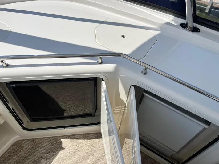  Yacht Photos Pics 2008 Sea Ray 58 Sedan yacht interior with open hatch and railing.