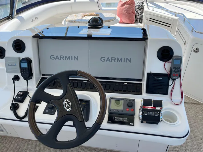  Yacht Photos Pics Helm of 2008 Sea Ray 58 Sedan with Garmin navigation system and steering wheel.