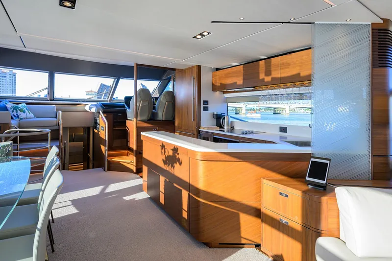 Janie II Yacht Photos Pics Luxurious interior of 2021 Princess Y78 yacht with modern kitchen and seating area.