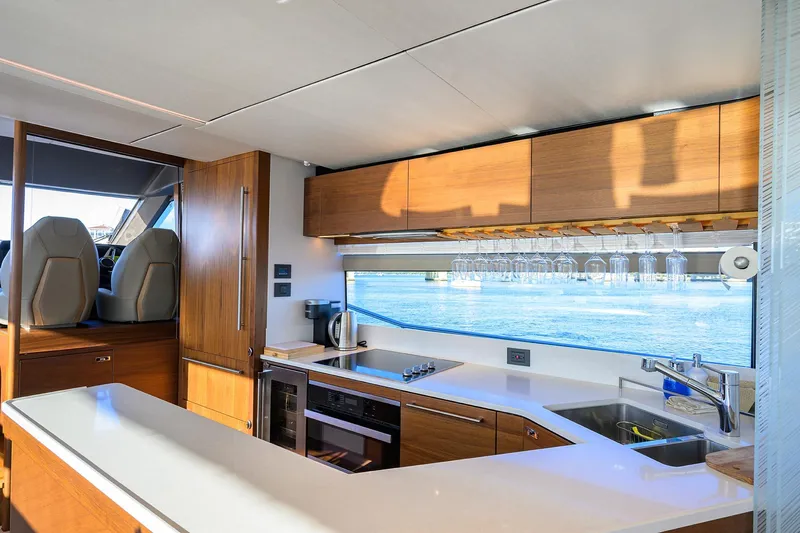 Janie II Yacht Photos Pics Luxurious kitchen interior of 2021 Princess Y78 yacht with ocean view.