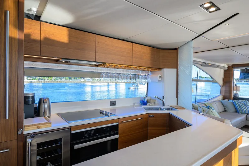 Janie II Yacht Photos Pics Luxurious kitchen interior of 2021 Princess Y78 yacht with waterfront view.