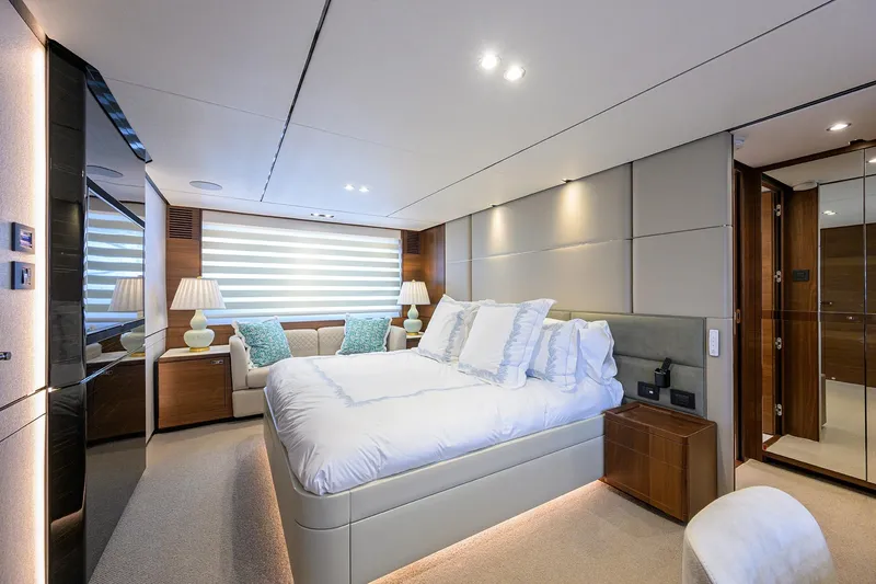 Janie II Yacht Photos Pics Luxurious bedroom interior of 2021 Princess Y78 yacht, featuring elegant decor and modern amenities.