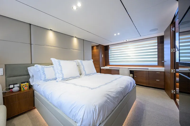 Janie II Yacht Photos Pics Luxurious bedroom interior on a 2021 Princess Y78 yacht, featuring elegant design and modern amenities.