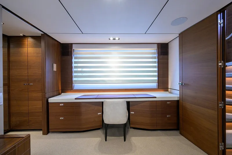 Janie II Yacht Photos Pics Luxurious interior of 2021 Princess Y78 yacht with elegant wood finishes and modern design.
