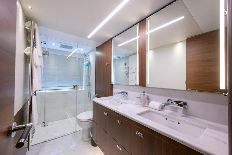 Janie II Yacht Photos Pics Luxurious bathroom in 2021 Princess Y78 yacht with modern fixtures and elegant design.