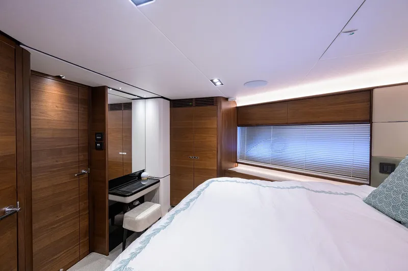 Janie II Yacht Photos Pics Luxurious interior of 2021 Princess Y78 yacht with elegant wood finishes and modern design.