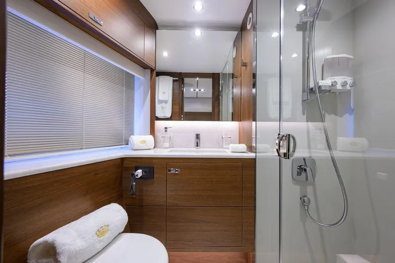 Janie II Yacht Photos Pics Luxurious bathroom interior of 2021 Princess Y78 yacht with modern fixtures and elegant design.