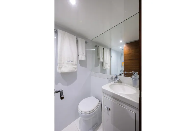 Janie II Yacht Photos Pics Luxurious bathroom in 2021 Princess Y78 yacht, featuring modern fixtures and elegant design.