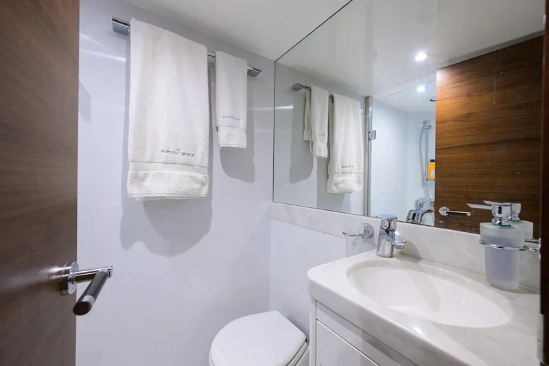 Janie II Yacht Photos Pics Luxurious bathroom in 2021 Princess Y78 yacht with modern fixtures and elegant design.
