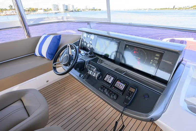Janie II Yacht Photos Pics Helm of 2021 Princess Y78 yacht with advanced navigation systems and luxurious seating.